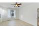 Simple bedroom with hardwood floors and a large window at 5307 52Nd W Ave, Bradenton, FL 34210