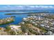 Aerial view of waterfront homes and lush landscape at 563 Juan Anasco Dr, Longboat Key, FL 34228