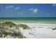 Secluded beach access with white sand and dunes at 563 Juan Anasco Dr, Longboat Key, FL 34228