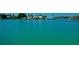 Waterfront property with a view of a luxury home at 563 Juan Anasco Dr, Longboat Key, FL 34228