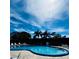 Inviting kidney-shaped pool with lounge chairs at 601 N Hercules Ave # 1403, Clearwater, FL 33765