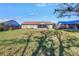 Spacious backyard with a view of the house and surrounding landscape at 6025 62Nd E Ct, Palmetto, FL 34221