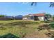 Spacious backyard with a large grassy area and shed at 6025 62Nd E Ct, Palmetto, FL 34221