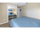 Guest bedroom with mirrored closet and queen bed at 6025 62Nd E Ct, Palmetto, FL 34221