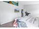 Bedroom with a queen bed, coastal decor, and treadmill at 6025 62Nd E Ct, Palmetto, FL 34221