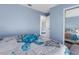 Guest bedroom with a queen bed and light blue walls at 6025 62Nd E Ct, Palmetto, FL 34221