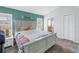 Main bedroom with a king-size bed and ensuite bathroom at 6025 62Nd E Ct, Palmetto, FL 34221
