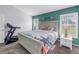 Primary bedroom with a queen bed and coastal decor at 6025 62Nd E Ct, Palmetto, FL 34221