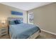 Bedroom with a queen bed and Siesta Key decor at 6025 62Nd E Ct, Palmetto, FL 34221