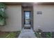 Inviting house exterior featuring a modern front door and landscaping at 6025 62Nd E Ct, Palmetto, FL 34221