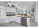 Galley kitchen with island and stainless steel appliances at 6025 62Nd E Ct, Palmetto, FL 34221