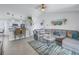 Open concept living space with gray sectional sofa and kitchen peek at 6025 62Nd E Ct, Palmetto, FL 34221