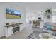 Bright living room with open floor plan, fireplace, and view of kitchen at 6025 62Nd E Ct, Palmetto, FL 34221