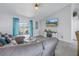 Spacious living area featuring comfortable seating and large TV at 6025 62Nd E Ct, Palmetto, FL 34221