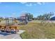 Community playground featuring slides, climbing structures, and benches at 6025 62Nd E Ct, Palmetto, FL 34221