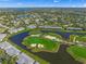 Aerial view of community with golf course and lake at 6946 W Country Club N Dr, Sarasota, FL 34243