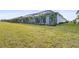 Large backyard with spacious lawn and lake view at 8328 Sea Glass Ct, Sarasota, FL 34240