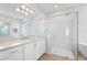 Modern bathroom with a large walk-in shower and free-standing tub at 8328 Sea Glass Ct, Sarasota, FL 34240