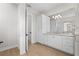 Bright bathroom with white cabinets and a double vanity at 8328 Sea Glass Ct, Sarasota, FL 34240