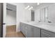 Modern bathroom with double vanity and gray cabinets at 8328 Sea Glass Ct, Sarasota, FL 34240