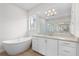 Modern bathroom with a soaking tub and double vanity at 8328 Sea Glass Ct, Sarasota, FL 34240