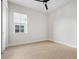 Light and airy bedroom with wood-look floors at 8328 Sea Glass Ct, Sarasota, FL 34240