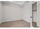 Simple bedroom with closet and wood-look floors at 8328 Sea Glass Ct, Sarasota, FL 34240