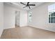 Spacious bedroom with hardwood floors and large windows at 8328 Sea Glass Ct, Sarasota, FL 34240