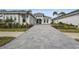 Elegant home exterior with a 3-car garage and landscaping at 8328 Sea Glass Ct, Sarasota, FL 34240