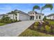 Stunning curb appeal with 3-car garage and lush landscaping at 8328 Sea Glass Ct, Sarasota, FL 34240