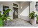 Inviting front entrance with double doors and landscaping at 8328 Sea Glass Ct, Sarasota, FL 34240