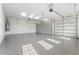 Two-car garage with epoxy flooring and automatic door opener at 8328 Sea Glass Ct, Sarasota, FL 34240