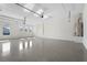 Large garage with epoxy flooring and ample storage space at 8328 Sea Glass Ct, Sarasota, FL 34240