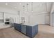 Modern kitchen with a large island and stainless steel appliances at 8328 Sea Glass Ct, Sarasota, FL 34240