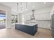 Bright kitchen features a large island, stainless steel appliances, and white cabinets at 8328 Sea Glass Ct, Sarasota, FL 34240