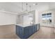 Spacious kitchen with large island, stainless steel appliances, and a view to the pool at 8328 Sea Glass Ct, Sarasota, FL 34240