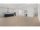 Open concept living area with kitchen and hardwood floors at 8328 Sea Glass Ct, Sarasota, FL 34240