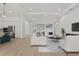 Open concept living area with kitchen and hardwood floors at 8328 Sea Glass Ct, Sarasota, FL 34240