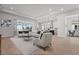 Spacious living room with open floor plan and view of pool at 8328 Sea Glass Ct, Sarasota, FL 34240