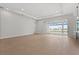 Open floor plan with sliding glass doors to lanai and pool at 8328 Sea Glass Ct, Sarasota, FL 34240