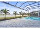 Enjoy the lake view from this screened pool and patio at 8328 Sea Glass Ct, Sarasota, FL 34240