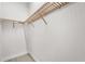 Spacious walk-in closet with custom wooden shelving at 8328 Sea Glass Ct, Sarasota, FL 34240
