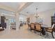 Open dining room with view into living room and kitchen at 8755 Dolomite Ave, North Port, FL 34287