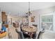 Charming dining area with round table and four chairs, near kitchen at 8755 Dolomite Ave, North Port, FL 34287