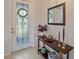 Entryway with a console table, mirror, and decorative items at 8755 Dolomite Ave, North Port, FL 34287