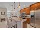 Well-equipped kitchen boasts granite counters and rich wood cabinets at 8755 Dolomite Ave, North Port, FL 34287