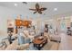 Open living room, kitchen, and dining area with tile floors and neutral colors at 8755 Dolomite Ave, North Port, FL 34287