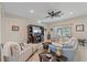 Living room with light blue sofa, and access to backyard patio at 8755 Dolomite Ave, North Port, FL 34287
