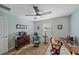 Home office with wooden desk, chair, and ceiling fan at 8755 Dolomite Ave, North Port, FL 34287