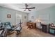 Home office with wooden desk, chair, and ceiling fan at 8755 Dolomite Ave, North Port, FL 34287